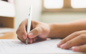 Businessman hand signing the document business contract agreement